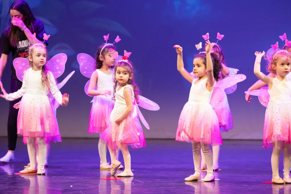 Ballet students performing on stage