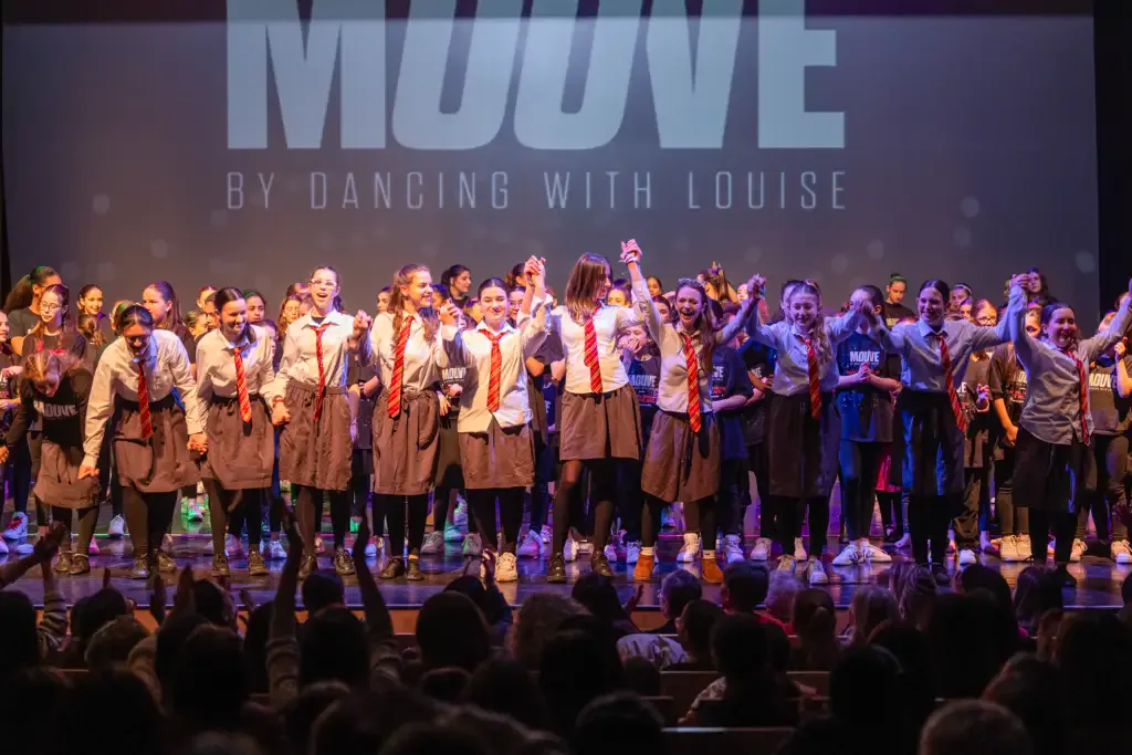Dancers performing at the Dancing Through the Decades showcase
