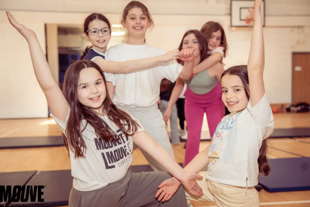 Children dancing at summer camp in London during fun-filled dance and drama session
